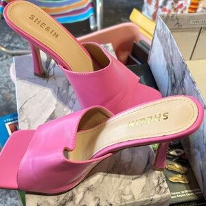 She & in pink mules.